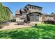 Wide view of the house showing the brick patio, screened porch, and manicured lawn at 7208 Ashton Gate Dr, Charlotte, NC 28270