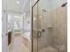 Elegant bathroom with a glass enclosed shower and a separate soaking tub at 7208 Ashton Gate Dr, Charlotte, NC 28270