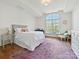 Inviting bedroom with hardwood floors, bright natural light, and elegant furniture at 7208 Ashton Gate Dr, Charlotte, NC 28270