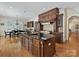 Spacious kitchen featuring a large center island, custom cabinetry, and hardwood floors at 7208 Ashton Gate Dr, Charlotte, NC 28270