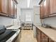 Spacious laundry room with ample storage space, utility sink, and modern tiling at 7208 Ashton Gate Dr, Charlotte, NC 28270