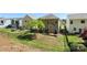 Aerial view of the backyard featuring a deck, patio, fire pit and fence at 78090 Rillstone Dr, Lancaster, SC 29720