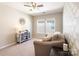 Cozy bedroom with comfortable sofa, decorative cabinet, and patterned wallpaper at 78090 Rillstone Dr, Lancaster, SC 29720