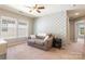 Neutral bedroom with sofa, modern wallpaper, and bright natural light at 78090 Rillstone Dr, Lancaster, SC 29720