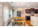 Dining room featuring a rustic table, stylish light fixture, and easy access to the kitchen at 78090 Rillstone Dr, Lancaster, SC 29720