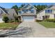 Charming two-story home featuring a two-car garage, inviting curb appeal, and well-maintained landscaping at 78090 Rillstone Dr, Lancaster, SC 29720