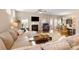 Bright living room with a cozy fireplace, hardwood floors, and comfortable sectional sofa at 78090 Rillstone Dr, Lancaster, SC 29720