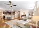 Spacious living room with hardwood floors, a cozy sectional sofa, and an open floor plan at 78090 Rillstone Dr, Lancaster, SC 29720
