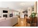 Open concept living room with fireplace and seamless flow into the dining and kitchen areas at 78090 Rillstone Dr, Lancaster, SC 29720