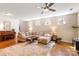 Inviting living room with hardwood floors, a cozy sectional sofa, and a decorative area rug at 78090 Rillstone Dr, Lancaster, SC 29720