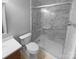 Bathroom with a shower with glass doors, tiled walls, and vanity with ample storage at 8000 Briardale Dr, Charlotte, NC 28212