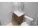 Clean bathroom featuring a stylish vanity, framed mirror, and a modern commode at 8000 Briardale Dr, Charlotte, NC 28212