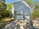 View of the home's side exterior with a large driveway and two-car garage at 8000 Briardale Dr, Charlotte, NC 28212