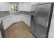 Stylish kitchen with stainless steel appliances, modern backsplash, and ample counter space at 8000 Briardale Dr, Charlotte, NC 28212