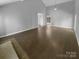 Open-concept living room featuring high ceilings and ample natural light with access to other rooms at 8000 Briardale Dr, Charlotte, NC 28212