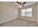 Cozy bedroom featuring neutral carpet, ceiling fan, and a window providing natural light at 835 Holdcroft Ln, Rock Hill, SC 29730