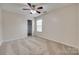 Bedroom featuring neutral carpet, ceiling fan, window, and a door to a closet at 835 Holdcroft Ln, Rock Hill, SC 29730