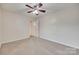Bedroom featuring neutral carpet, ceiling fan, and door to hall at 835 Holdcroft Ln, Rock Hill, SC 29730