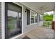 A inviting porch with a fan, gray siding and white railings at 835 Holdcroft Ln, Rock Hill, SC 29730