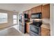 A modern kitchen equipped with stainless steel appliances and wooden cabinets at 835 Holdcroft Ln, Rock Hill, SC 29730
