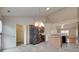 Open kitchen with stainless steel appliances, a breakfast bar, and access to a pantry and adjoining living room at 835 Holdcroft Ln, Rock Hill, SC 29730