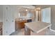 Kitchen featuring wooden cabinets, center island and a view of the stairs at 835 Holdcroft Ln, Rock Hill, SC 29730