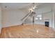 Open-concept living room with vaulted ceiling, hardwood floors, and a fireplace at 835 Holdcroft Ln, Rock Hill, SC 29730