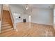 Spacious living room with hardwood floors, fireplace and stairs at 835 Holdcroft Ln, Rock Hill, SC 29730