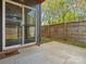Private back patio with concrete flooring, perfect for outdoor dining and entertaining at 913 Van Every St, Charlotte, NC 28205