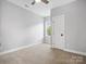 Comfortable bedroom with neutral carpet, ceiling fan, and natural light from a window at 913 Van Every St, Charlotte, NC 28205