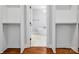 Custom closet shelving leading to en-suite bath with soaking tub and modern fixtures at 913 Van Every St, Charlotte, NC 28205