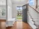 Home foyer featuring hardwood floors and staircase at 913 Van Every St, Charlotte, NC 28205