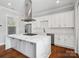Bright kitchen with stainless appliances, waterfall island and custom cabinets at 913 Van Every St, Charlotte, NC 28205