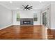 Bright living room featuring a modern fireplace, hardwood floors, and large windows with natural light at 913 Van Every St, Charlotte, NC 28205