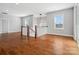 Open-concept living space featuring hardwood floors, natural light, and staircase at 913 Van Every St, Charlotte, NC 28205