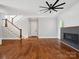 Living room with hardwood floors, fireplace, and staircase at 913 Van Every St, Charlotte, NC 28205