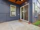 Charming outdoor patio with direct access to the home's interior via sliding glass doors at 913 Van Every St, Charlotte, NC 28205