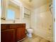 Bathroom featuring a single sink vanity, mirror, and a shower-tub combination at 9615 Littleleaf Dr, Charlotte, NC 28215