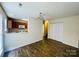 Dining room features tile floors, neutral paint, and access to the kitchen at 9615 Littleleaf Dr, Charlotte, NC 28215