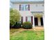 Inviting townhouse featuring manicured landscaping and a charming entrance at 9615 Littleleaf Dr, Charlotte, NC 28215