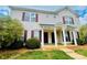 Inviting townhouse with a charming entrance and manicured landscaping at 9615 Littleleaf Dr, Charlotte, NC 28215