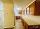 Traditional kitchen with wood cabinets, tile flooring, and modern appliances at 9615 Littleleaf Dr, Charlotte, NC 28215