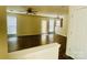 Spacious living room featuring wood-look tile floors and abundant natural light at 9615 Littleleaf Dr, Charlotte, NC 28215