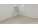 Bedroom with neutral walls and carpet, featuring window and natural light at 9727 White Chapel Nw Dr, Concord, NC 28027