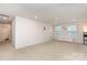 Spacious bonus room featuring neutral walls and carpet, with ample natural light at 9727 White Chapel Nw Dr, Concord, NC 28027