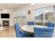Bright dining area has natural light, table for four and view to the backyard at 9727 White Chapel Nw Dr, Concord, NC 28027