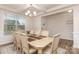 Bright dining area with coffered ceilings and a view of the outdoors at 9727 White Chapel Nw Dr, Concord, NC 28027