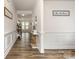 Inviting hallway with wood flooring, decorative molding and stylish decor for an elegant entrance at 9727 White Chapel Nw Dr, Concord, NC 28027