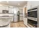 Modern kitchen featuring stainless steel appliances and granite countertops at 9727 White Chapel Nw Dr, Concord, NC 28027