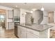 Open kitchen with granite countertops, stainless appliances, and an island sink at 9727 White Chapel Nw Dr, Concord, NC 28027